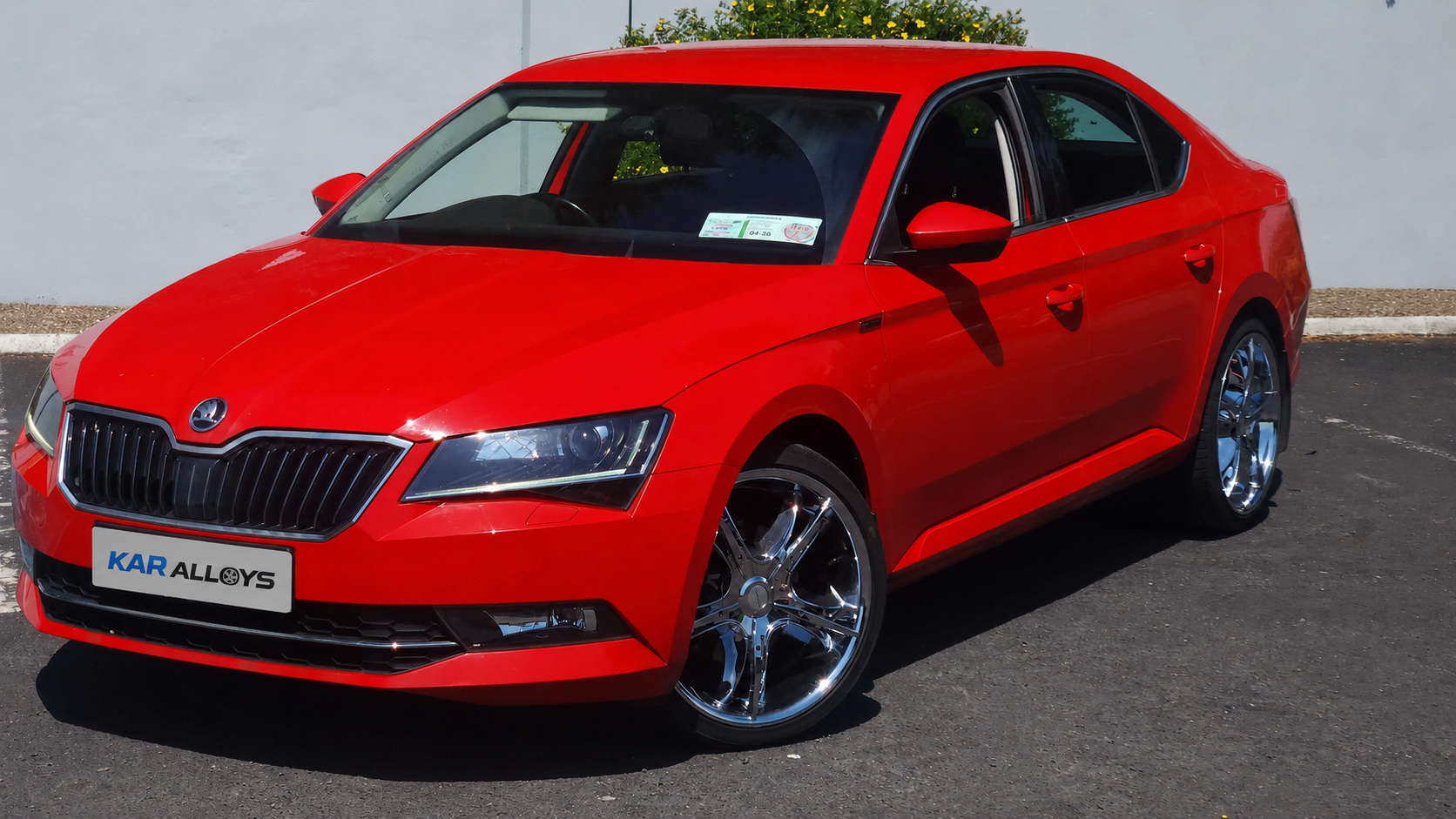 Red Škoda Superb KAR Alloys flagship car with 20-inch chrome Ecanto E-181 alloy wheels